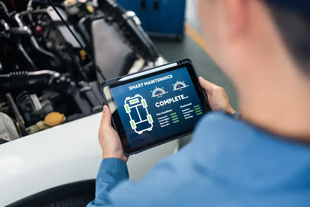 Automotive mechanic running diagnostic tool for Instant ECU remapping